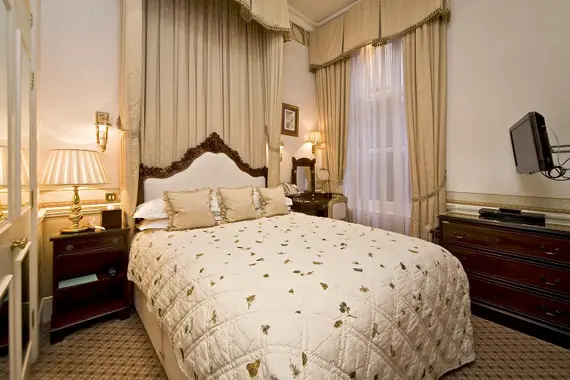 A sumptuously chic bedroom in the William and Catherine Suite