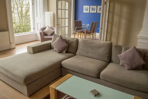 A lovely, light living area leading to the dining room
