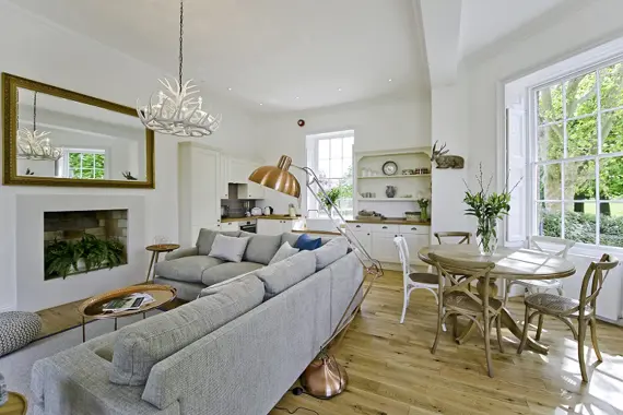 A gorgeous, comfortable sofa and dining area in the Upper Garden Suite