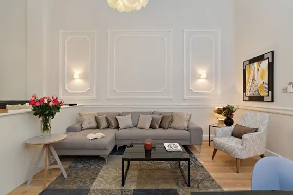 A spacious, comfortable living area in a deluxe studio apartment