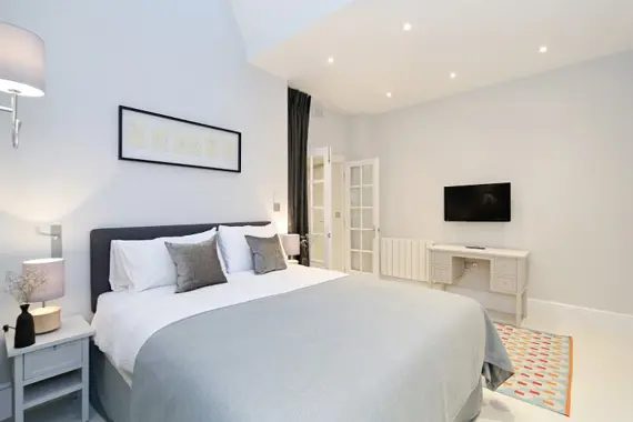 A very comfortable, grand bed in a three bedroom standard apartment