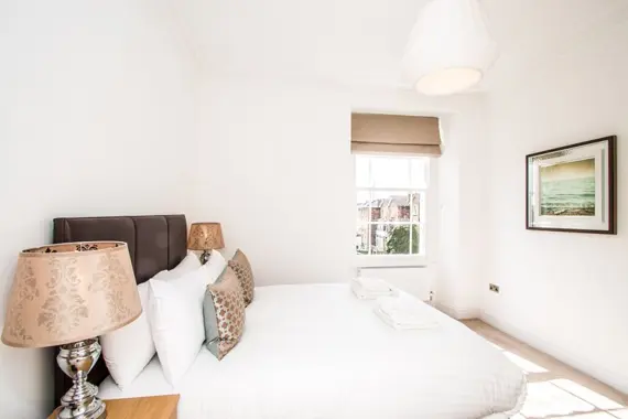 A comfortable, crisp bedroom