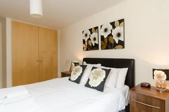 A light bedroom with ample storage