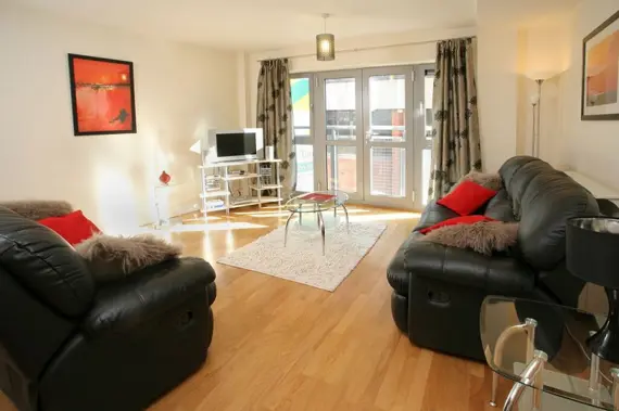 A bright, spacious living area with a balcony