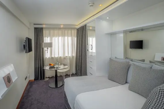 A sleek, modern standard studio apartment