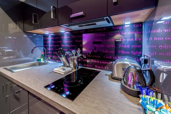 The sleek kitchens have modern appliances